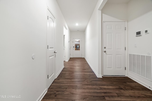 hall with dark hardwood / wood-style flooring