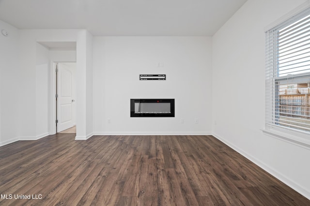 empty room featuring dark wood-type flooring