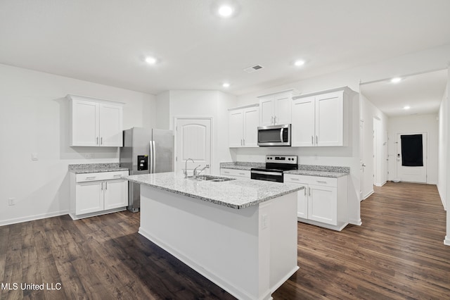 kitchen featuring white cabinetry, sink, a center island with sink, and appliances with stainless steel finishes