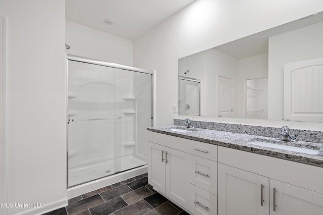 bathroom with vanity and an enclosed shower