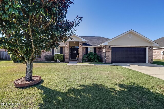 view of front of house with a garage and a front lawn