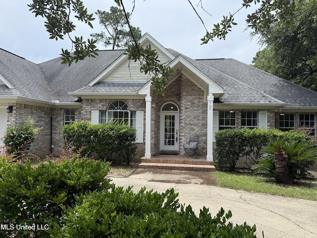 700 Tantallon Dr, Ocean Springs, MS 39564 - view of front of property featuring brick siding and roof with shingles