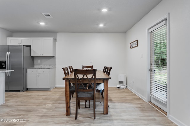 dining room with light hardwood / wood-style flooring