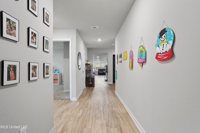 hallway featuring light hardwood / wood-style flooring