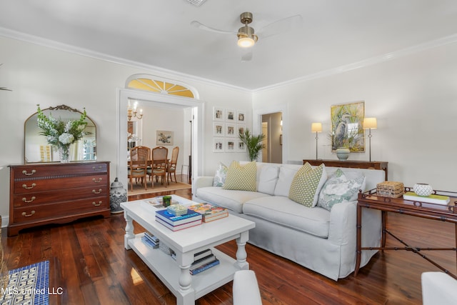 living room with crown molding, ceiling fan, and dark hardwood / wood-style flooring