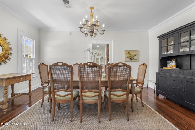 dining area with visible vents, crown molding, a chandelier, and dark wood-style floors