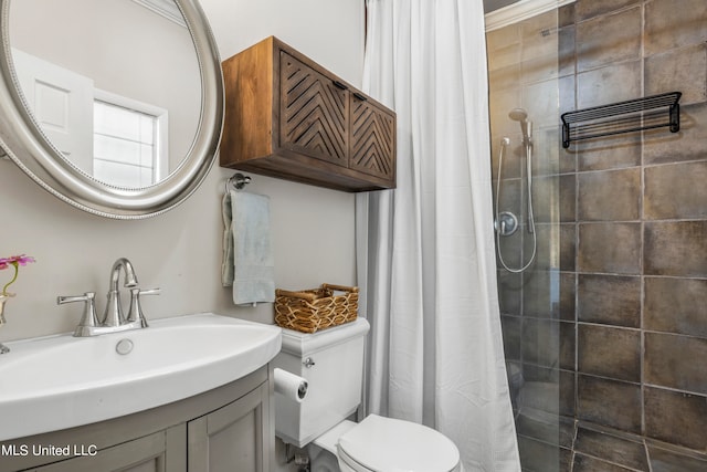 bathroom featuring vanity, toilet, and curtained shower