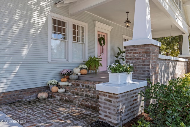 entrance to property with a porch