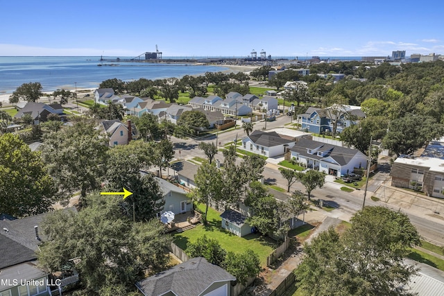 drone / aerial view with a water view and a residential view