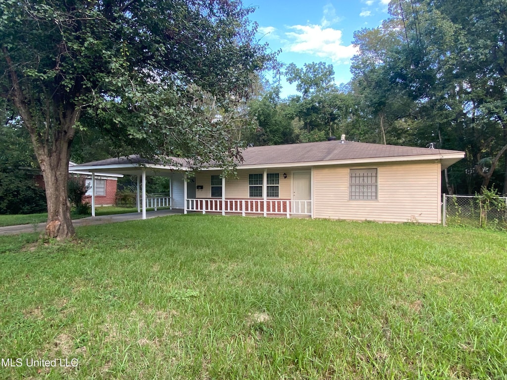 ranch-style home with covered porch and a front yard