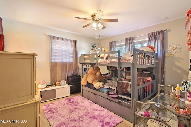 719 Holly Hills Dr, Biloxi, MS 39532 - bedroom featuring wood finished floors and a ceiling fan