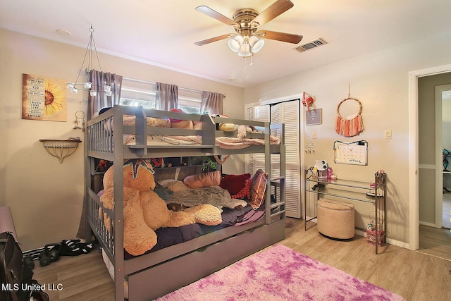 719 Holly Hills Dr, Biloxi, MS 39532 - bedroom featuring wood finished floors, a closet, and ceiling fan