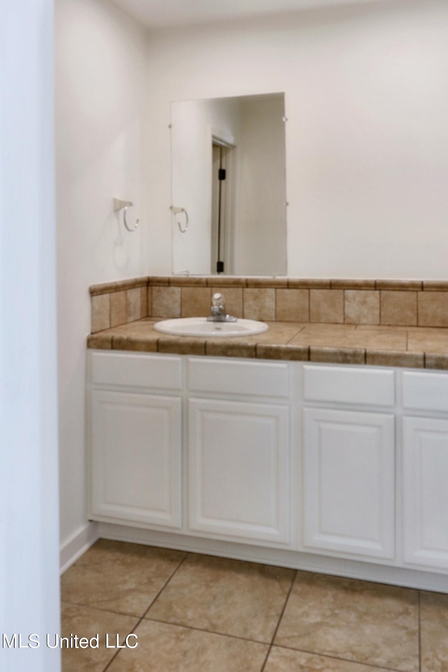 bathroom featuring vanity and tile patterned floors