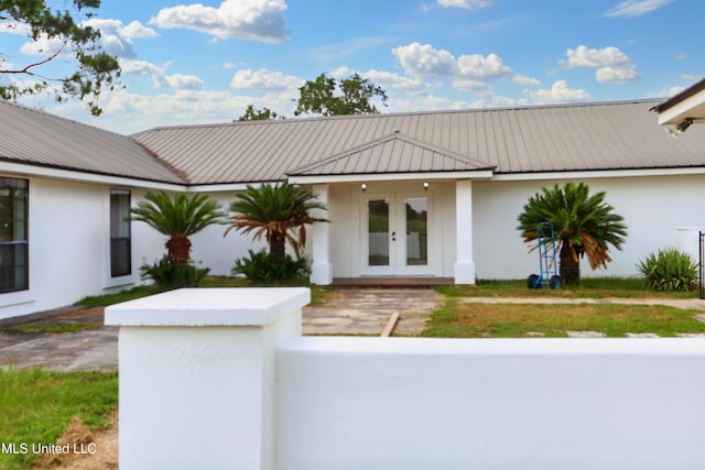 view of front facade featuring french doors