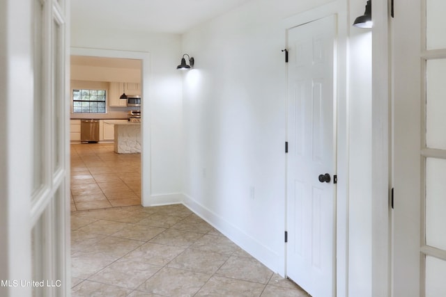 hallway with light tile patterned floors