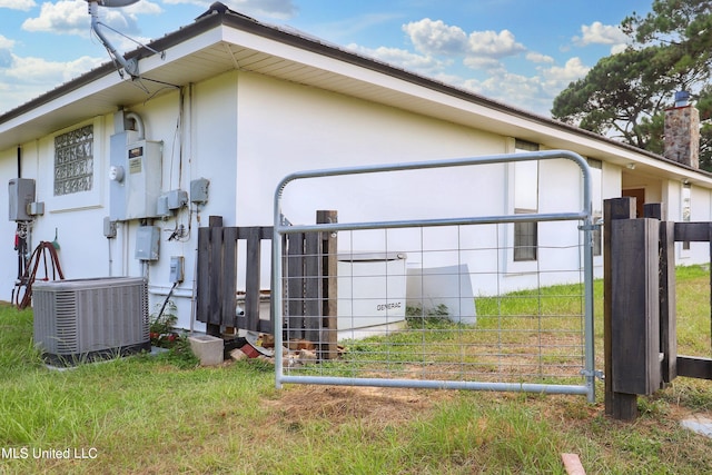 view of side of property with cooling unit