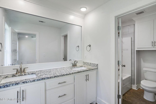 full bathroom with vanity, toilet, and  shower combination