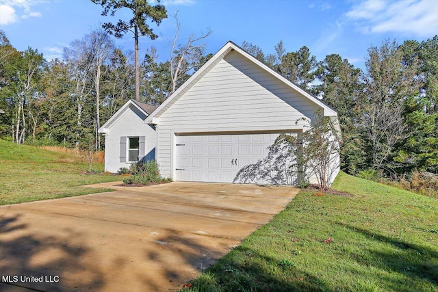 view of home's exterior featuring a yard and a garage