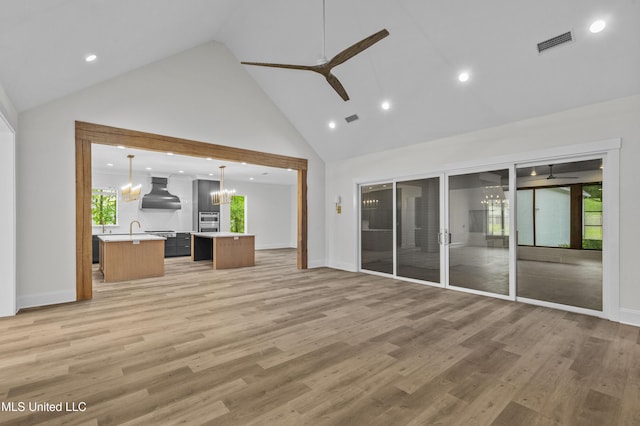 104 Westlake Cir W, Madison, MS 39110 - unfurnished living room with ceiling fan, high vaulted ceiling, plenty of natural light, a chandelier, and recessed lighting