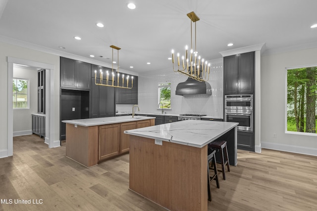 104 Westlake Cir W, Madison, MS 39110 - kitchen with a spacious island, tasteful backsplash, light wood-type flooring, recessed lighting, and healthy amount of natural light