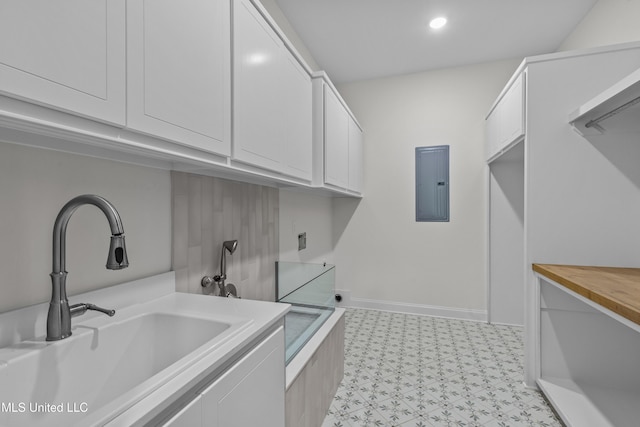 104 Westlake Cir W, Madison, MS 39110 - washroom featuring cabinet space, electric panel, electric dryer hookup, light flooring, and washer hookup