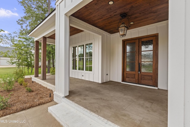 104 Westlake Cir W, Madison, MS 39110 - doorway to property featuring french doors, board and batten siding, and a patio