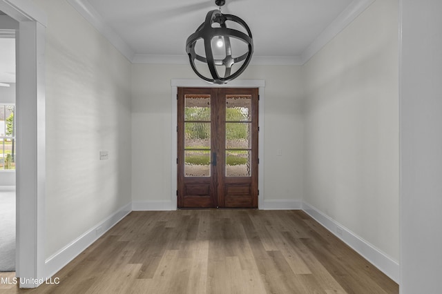 104 Westlake Cir W, Madison, MS 39110 - entrance foyer with plenty of natural light, a chandelier, french doors, wood finished floors, and crown molding