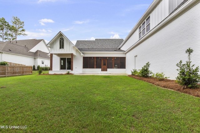 104 Westlake Cir W, Madison, MS 39110 - rear view of property featuring board and batten siding, a sunroom, and roof with shingles