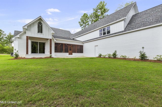 104 Westlake Cir W, Madison, MS 39110 - back of house featuring board and batten siding, a lawn, a sunroom, and a shingled roof