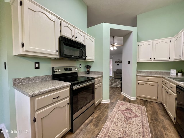 5306 Kristy Ln, Southaven, MS 38671 - kitchen with electric range, black microwave, a ceiling fan, dark wood-type flooring, and dishwashing machine