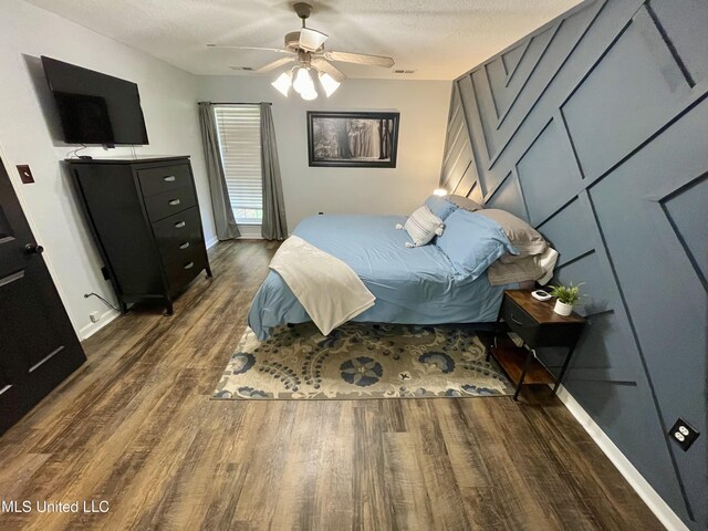 5306 Kristy Ln, Southaven, MS 38671 - bedroom featuring wood finished floors, a textured ceiling, and ceiling fan