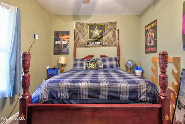 bedroom featuring a textured ceiling