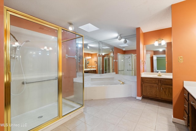 full bath featuring a textured ceiling, a shower stall, vanity, tile patterned flooring, and a bath