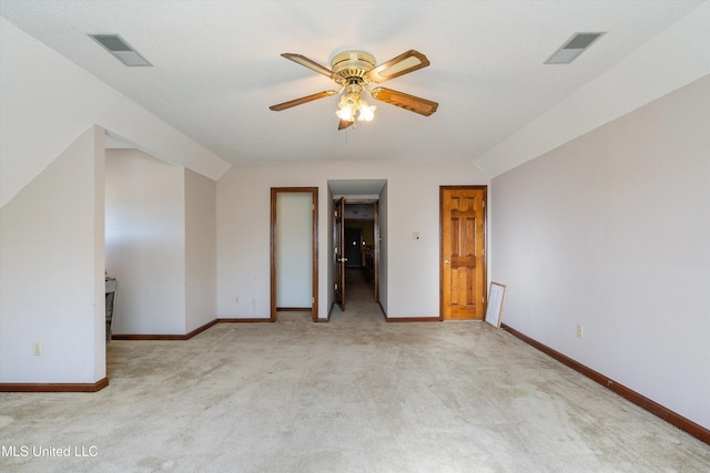 interior space with carpet floors, visible vents, ceiling fan, and baseboards