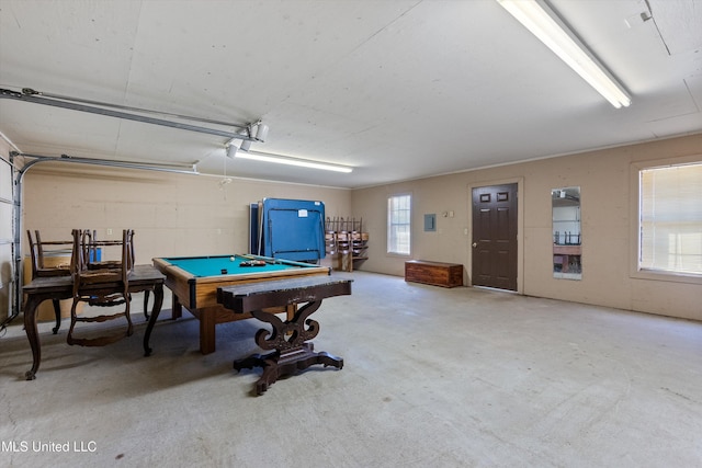 rec room featuring a garage, concrete floors, and billiards