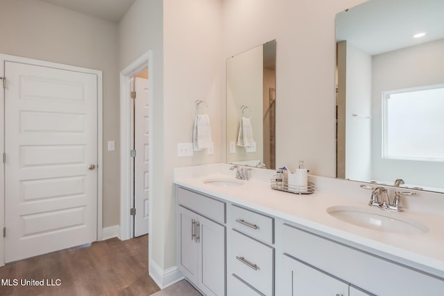 bathroom featuring vanity and hardwood / wood-style floors