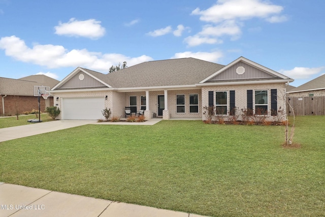 view of front of property featuring a garage and a front lawn