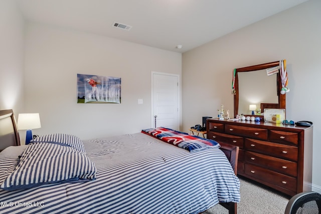 bedroom featuring light carpet