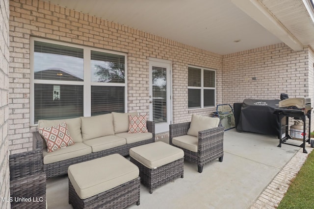 view of patio with an outdoor hangout area and grilling area