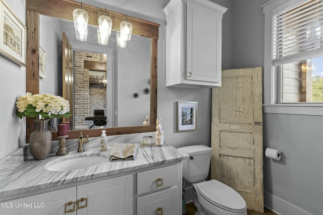 bathroom with vanity and toilet