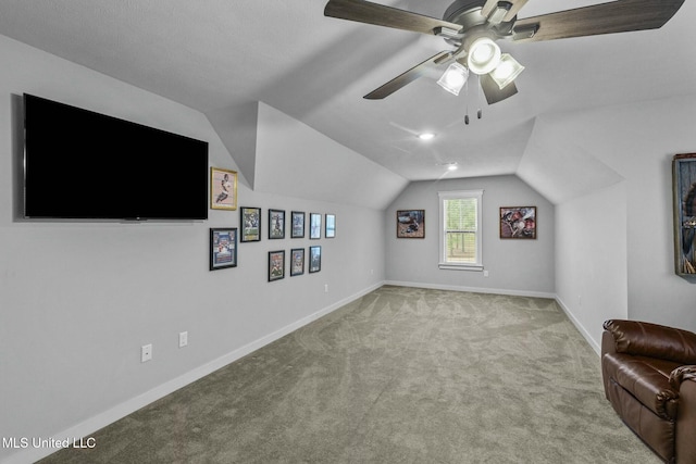 bonus room featuring light carpet, lofted ceiling, and ceiling fan