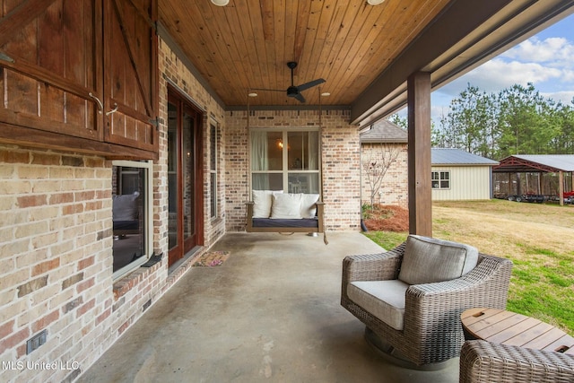 view of patio / terrace featuring ceiling fan