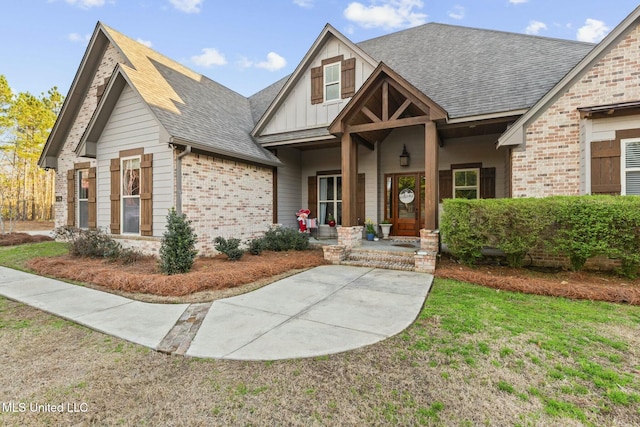 craftsman-style home featuring a porch and a front lawn