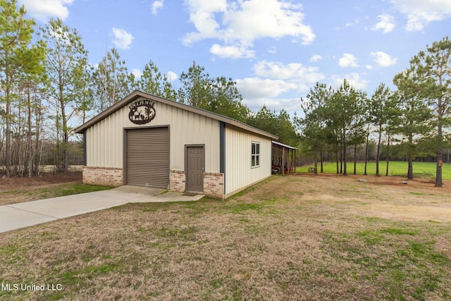 garage featuring a yard