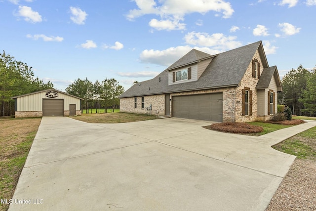 view of front of property featuring a garage and a front lawn