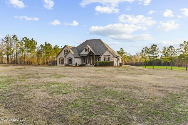 view of front of property with a front lawn