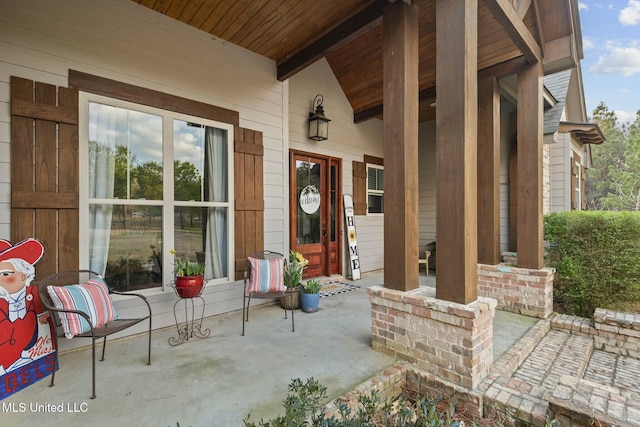 property entrance with covered porch