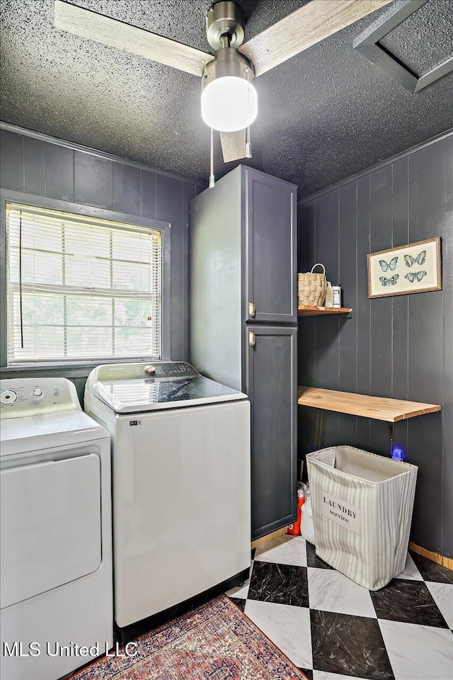 12661 Springridge Rd, Terry, MS 39170 - laundry area featuring independent washer and dryer, marble finish flooring, a textured ceiling, and cabinet space