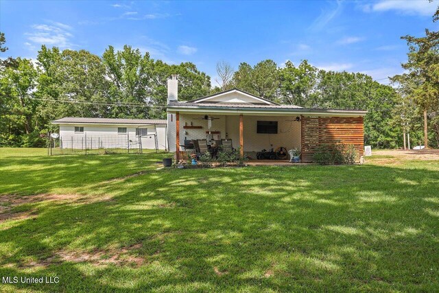12661 Springridge Rd, Terry, MS 39170 - back of property featuring a chimney, a ceiling fan, and a patio area