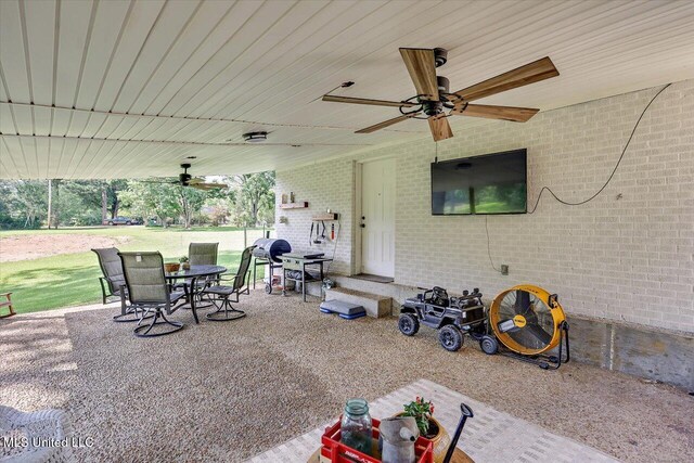 12661 Springridge Rd, Terry, MS 39170 - view of patio with ceiling fan and outdoor dining area